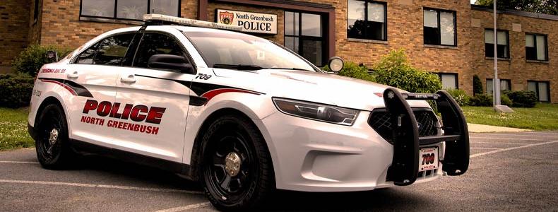 Police cruiser in front of police building